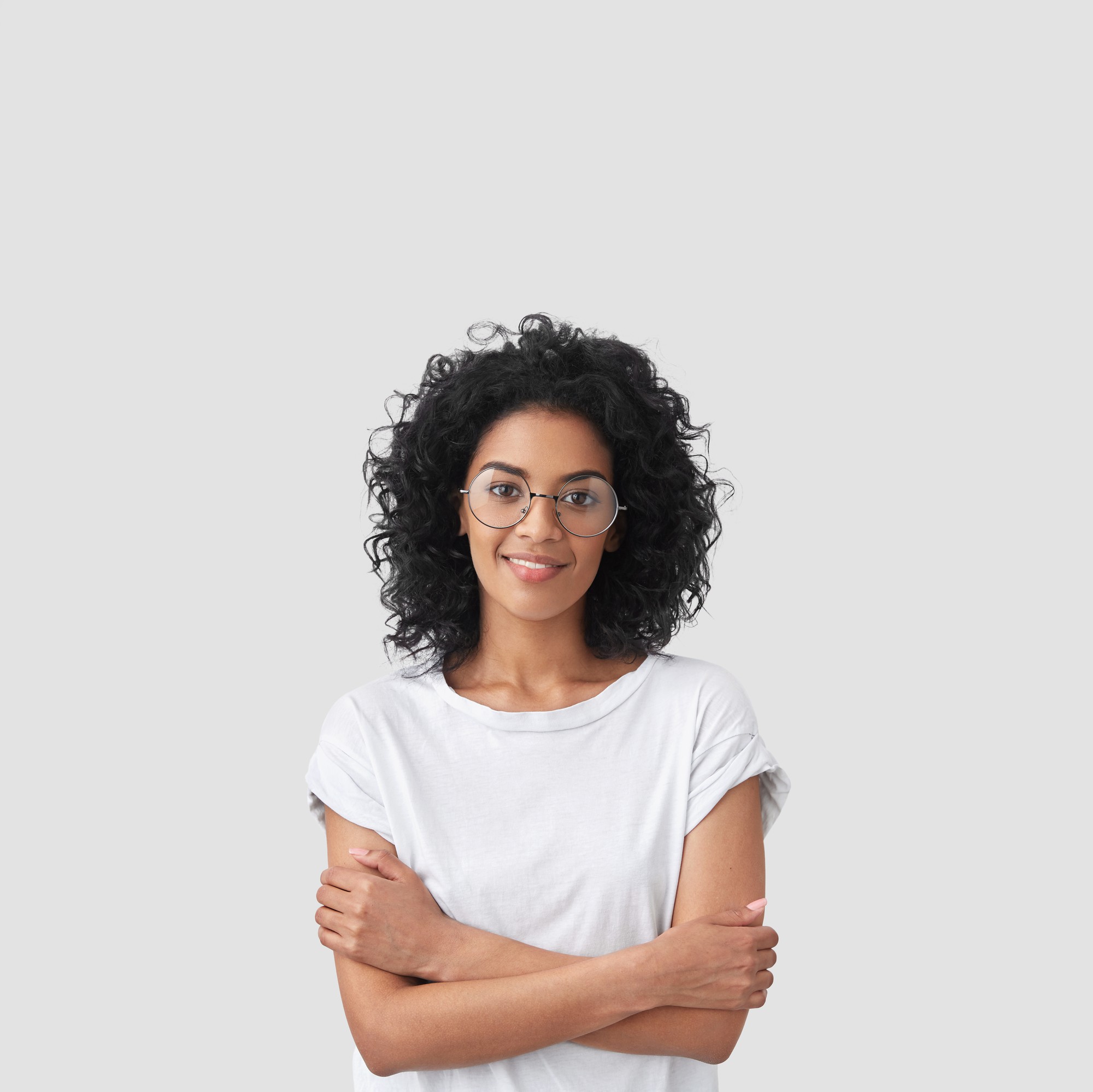 vertical shot happy dark skinned female with curly hair